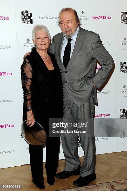 The Dorchester Outstanding Achievement Award winner Dame Judi Dench poses with Sir Peter Hall in the press room at the South Bank Sky Arts Awards at...