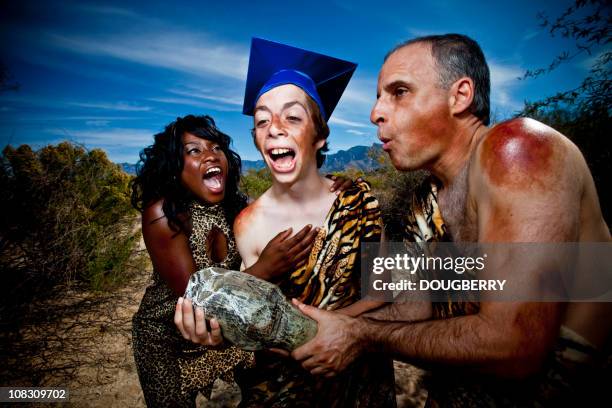 caveman graduation - caveman stockfoto's en -beelden