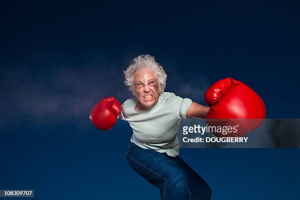 boxing grandmother - punching stock pictures, royalty-free photos & images