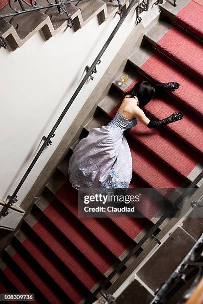 elegant woman laying on the stairs - passed out drunk stockfoto's en -beelden