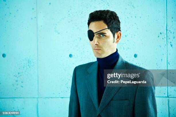 white collar crime: businessman with eye patch - eye patch stock pictures, royalty-free photos & images