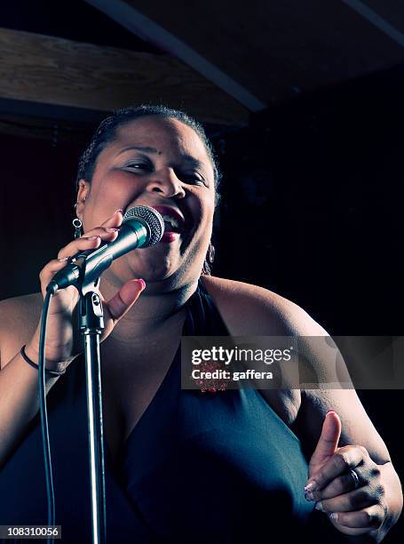 singing pop woman - lounge singer stock pictures, royalty-free photos & images