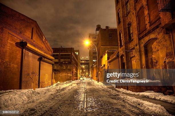 dark city street in brooklyn - new york city snow stock pictures, royalty-free photos & images