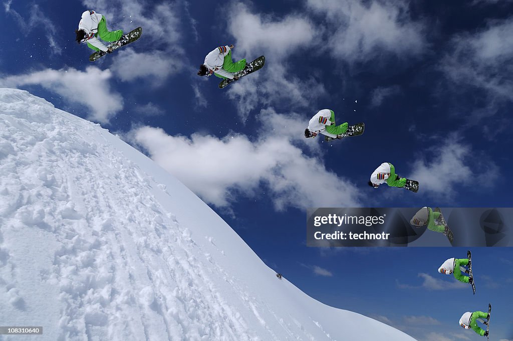 Multiple image of snowboarder in mid air