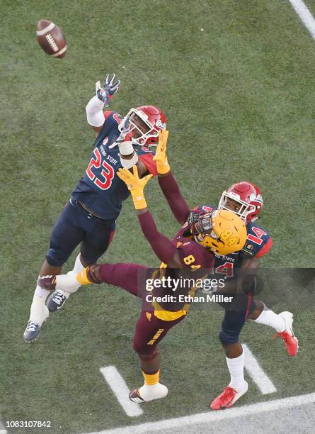 Defensive backs Juju Hughes and Jaron Bryant of the Fresno State Bulldogs break up a pass intended for Frank Darby of the Arizona State Sun Devils...