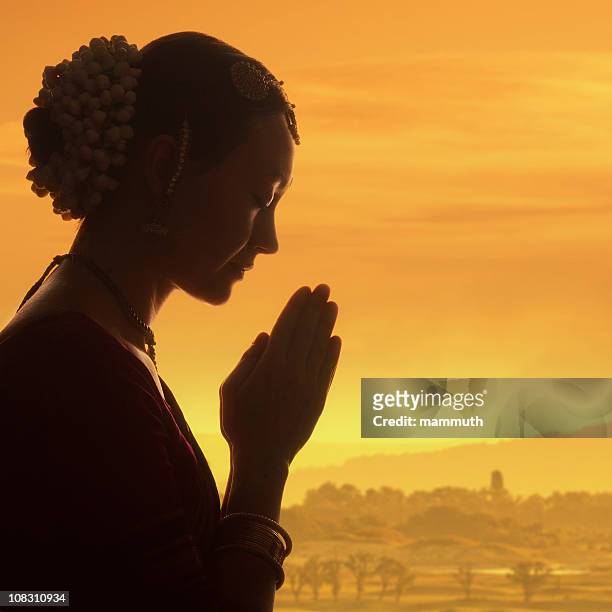 praying at dawn - hinduism stock pictures, royalty-free photos & images