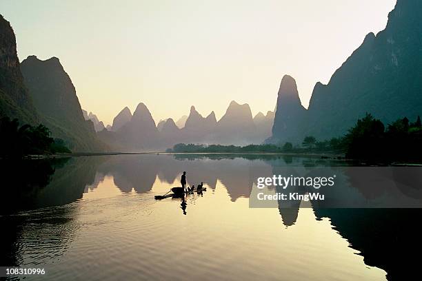 fisherman in china - river li stock pictures, royalty-free photos & images