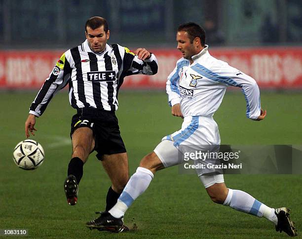 Zinedine Zidane of Juventus and Sinisa Mihajlovic of Lazio challenge for the ball during the Serie A 6th Round League match between Juventus and...