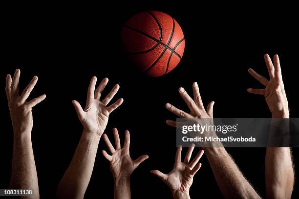 rebounding - basketball blocking shot stock pictures, royalty-free photos & images
