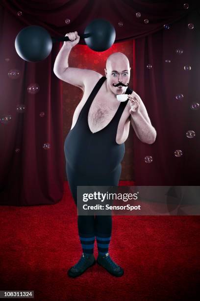 sensitive strongman - circus curtains stock pictures, royalty-free photos & images