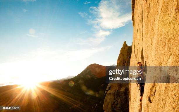 young woman leading a climbing route in colorado - co director stock pictures, royalty-free photos & images