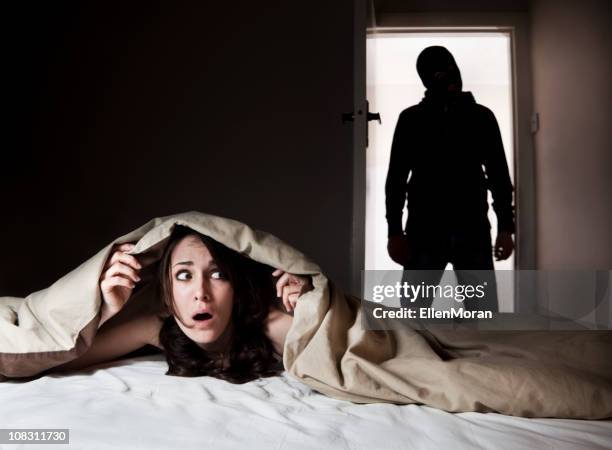 person hiding during home invasion  - burglary stock pictures, royalty-free photos & images