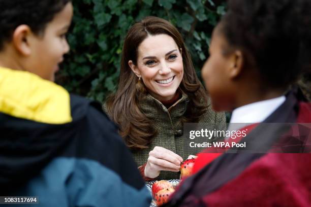 Catherine, Duchess of Cambridge helps make winter bird feed as she visits Islington Community Garden on January 15, 2019 in London, England.