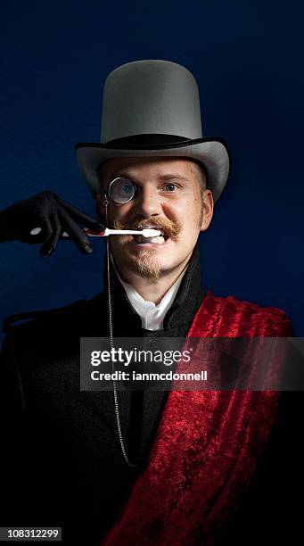 brushing - monocle stock pictures, royalty-free photos & images