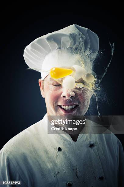 chef getting a egg in the head - food fight stock pictures, royalty-free photos & images