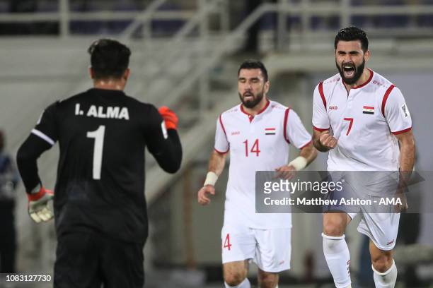 Omar Khrbin of Syria celebrates after scoring a goal to make it 1-1 during the AFC Asian Cup Group B match between Australia and Syria at Khalifa Bin...