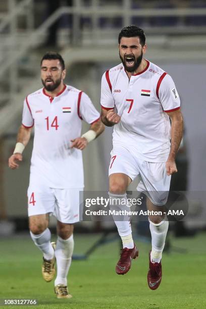 Omar Khrbin of Syria celebrates after scoring a goal to make it 1-1 during the AFC Asian Cup Group B match between Australia and Syria at Khalifa Bin...