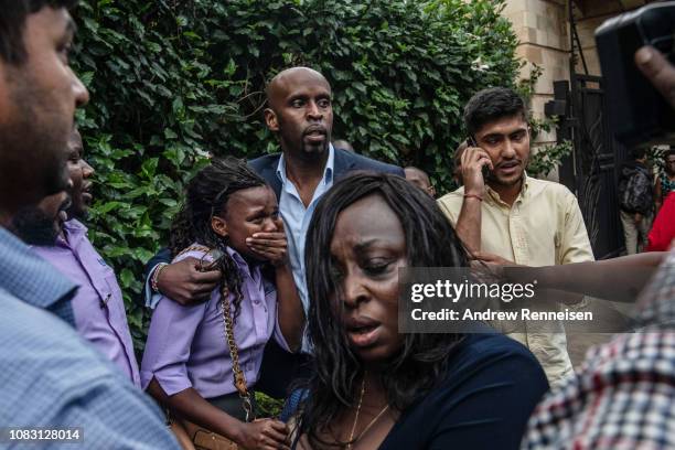 Woman reacts after being rescued from the Dusit Hotel on January 15, 2018 in Nairobi, Kenya. A current security operation is underway after...