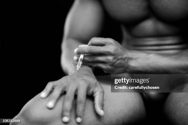 injecting steroids or drugs - steroids stock pictures, royalty-free photos & images