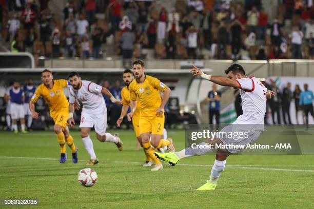 Omar Alsoma of Syria scores a goal to make it 2-2 during the AFC Asian Cup Group B match between Australia and Syria at Khalifa Bin Zayed Stadium on...