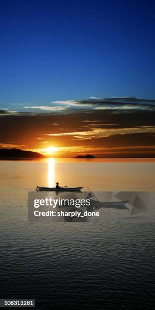 xxxl sunset kayaking - two people canoeing on a lake stock pictures, royalty-free photos & images