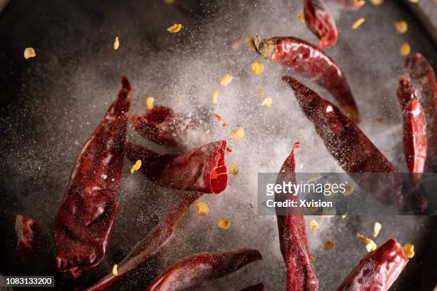 red chili pepper in high speed photographer - chilli con carne foto e immagini stock