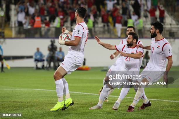Omar Alsoma of Syria celebrates after scoring a goal to make it 2-2 during the AFC Asian Cup Group B match between Australia and Syria at Khalifa Bin...