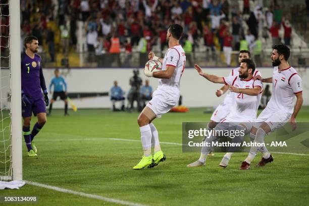 Omar Alsoma of Syria celebrates after scoring a goal to make it 2-2 during the AFC Asian Cup Group B match between Australia and Syria at Khalifa Bin...