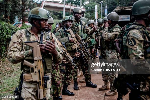 Kenyan special forces take position outside a hotel complex following an explosion in Nairobi's Westlands suburb on January 15 in Kenya. - The...
