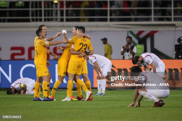 Tom Rogic of Australia celebrates after scoring a goal to make it 3-2 during the AFC Asian Cup Group B match between Australia and Syria at Khalifa...