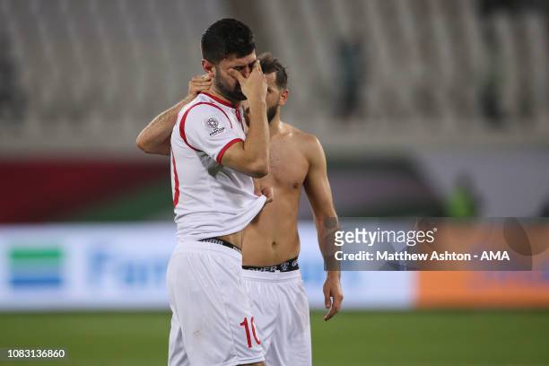Dejected Mohammed Osman of Syria reacts at full time during the AFC Asian Cup Group B match between Australia and Syria at Khalifa Bin Zayed Stadium...