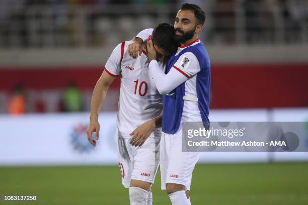 Jehad Al Baour of Syria consoles a dejected Mohammed Osman of Syria at full time during the AFC Asian Cup Group B match between Australia and Syria...