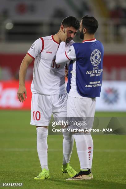 Jehad Al Baour of Syria consoles a dejected Mohammed Osman of Syria at full time during the AFC Asian Cup Group B match between Australia and Syria...