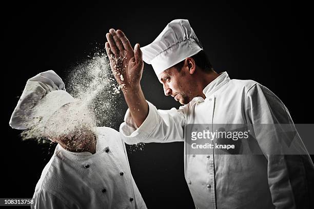 chefs having a food fight - chef competition stock pictures, royalty-free photos & images