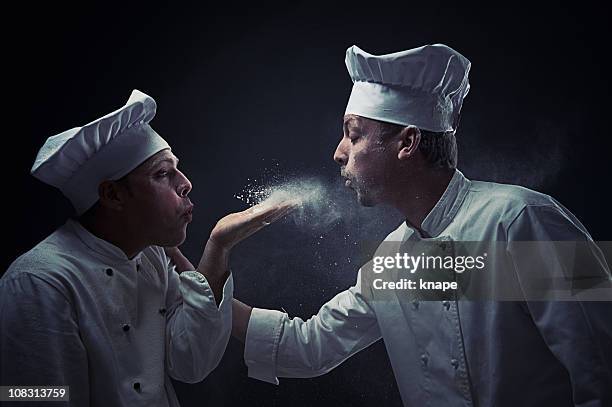 chefs foodfighting with flour - chef competition stock pictures, royalty-free photos & images