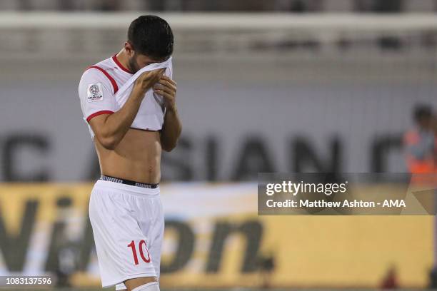 Dejected Mohammed Osman of Syria reacts at full time during the AFC Asian Cup Group B match between Australia and Syria at Khalifa Bin Zayed Stadium...