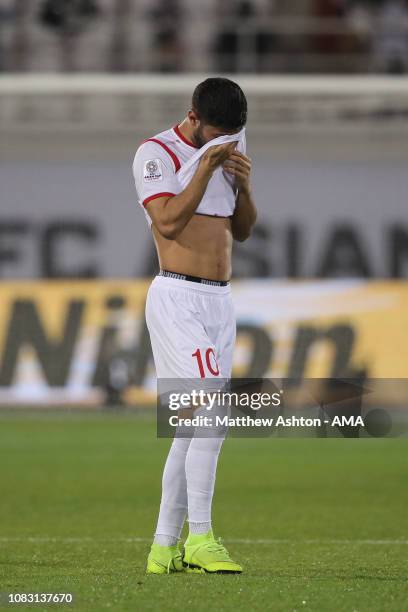 Dejected Mohammed Osman of Syria reacts at full time during the AFC Asian Cup Group B match between Australia and Syria at Khalifa Bin Zayed Stadium...