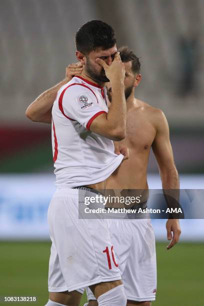 Dejected Mohammed Osman of Syria reacts at full time during the AFC Asian Cup Group B match between Australia and Syria at Khalifa Bin Zayed Stadium...