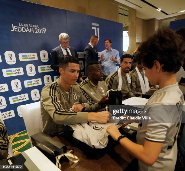 Cristiano Ronaldo of Juventus signing autographs and taking selfie during a meet and greet on January 15, 2019 in Jeddah, Saudi Arabia.