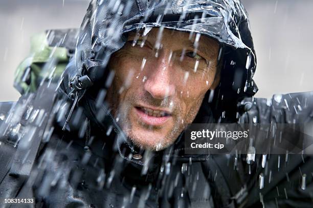 adventurer in typhoon - regnkläder bildbanksfoton och bilder