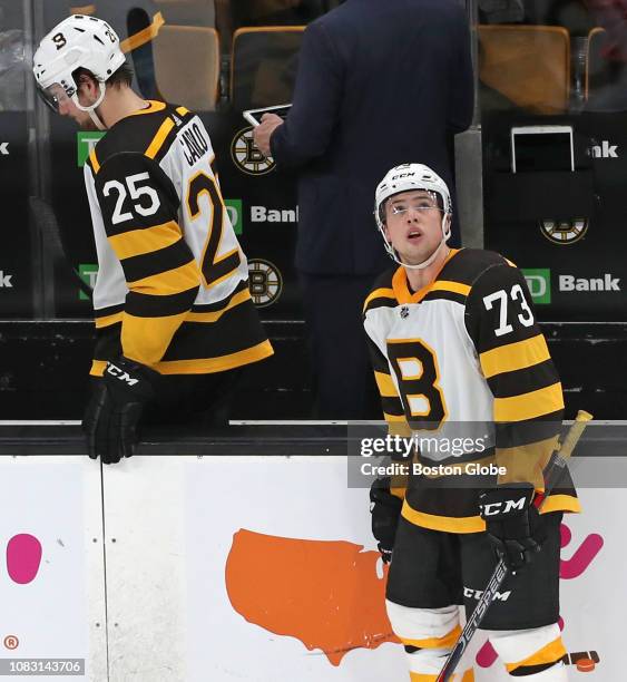 Boston Bruins' Charlie McAvoy watches the replay of Montreal's game-winning goal 15 seconds into overtime that gave the Canadiens a 3-2 victory. His...