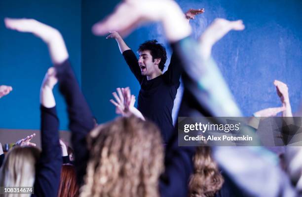 practicing class at a private dancing school - dancers exercising teacher stockfoto's en -beelden