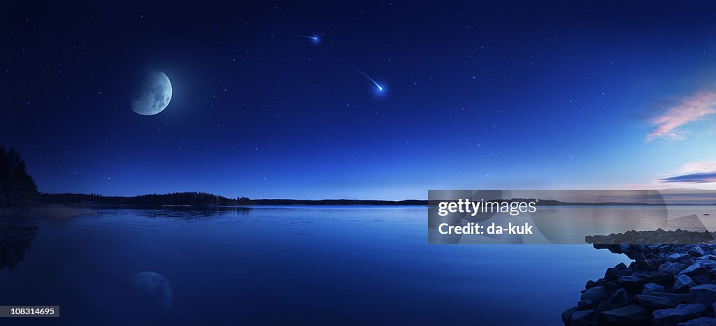 Rising moon over lake