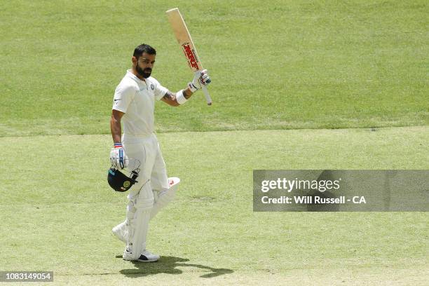 Virat Kohli of India celebrates after reaching his century during day three of the second match in the Test series between Australia and India at...