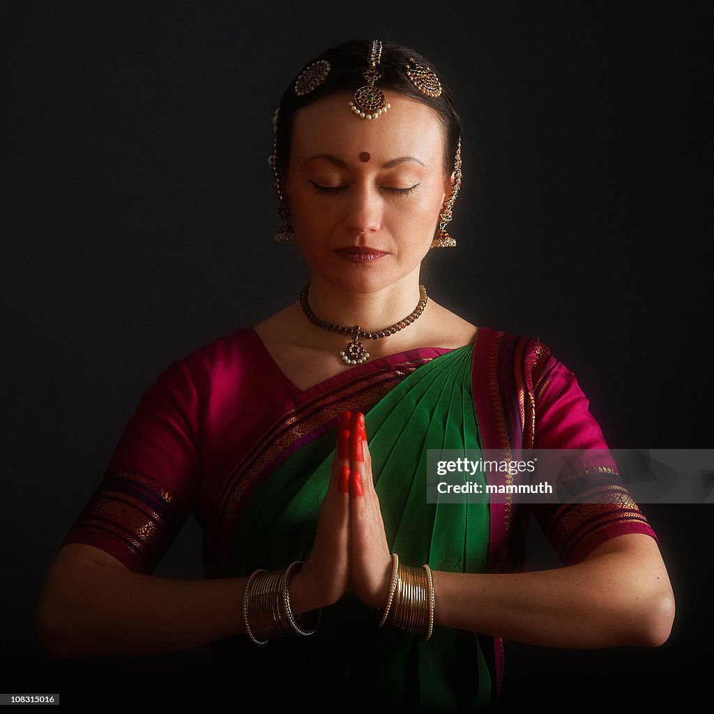 Praying indian woman