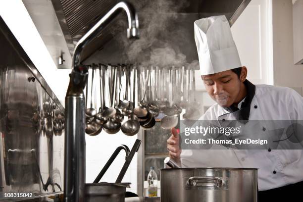 chef and trainee - chef smelling food stockfoto's en -beelden