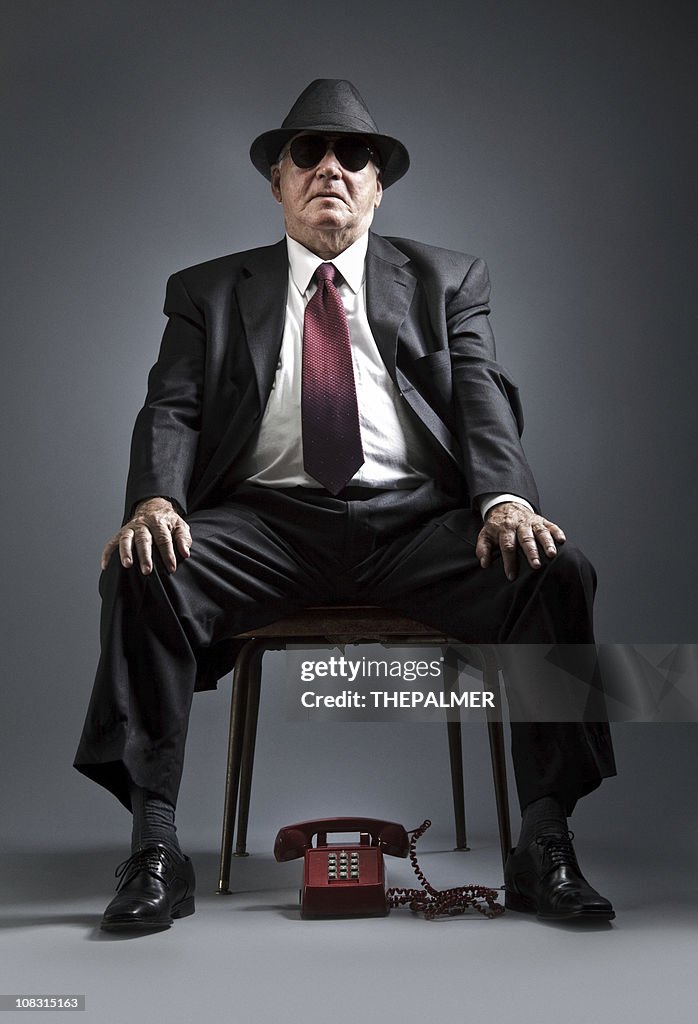 Elegant senior man waiting for a phone call