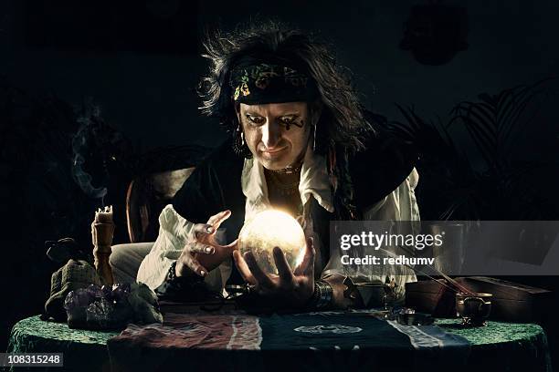 mystical gypsy and crystal ball - fortune teller stock pictures, royalty-free photos & images