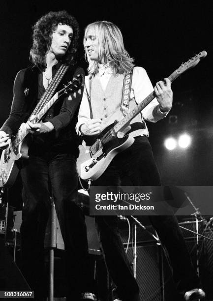 Mike Campbell and Tom Petty from Tom Petty & The Heartbreakers perform live on stage at the Hammersmith Odeon before their concert on May 14 1977