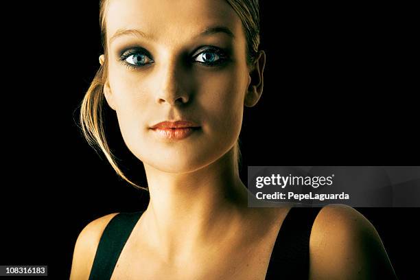 woman with blue eyes in black background - blonde hair black background stock pictures, royalty-free photos & images